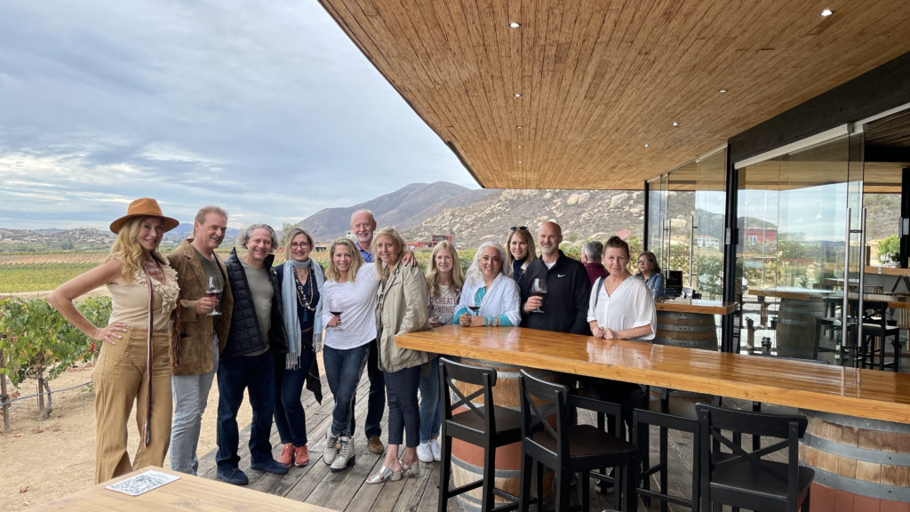 group of business people standing on the deck of a restaurant in Mexico