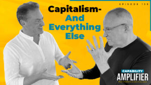 Episode 139 Art: Text reading "Capitalism - And Everything Else" on a bold yellow background with photos of Mike Koenigs and Dan Sullivan.